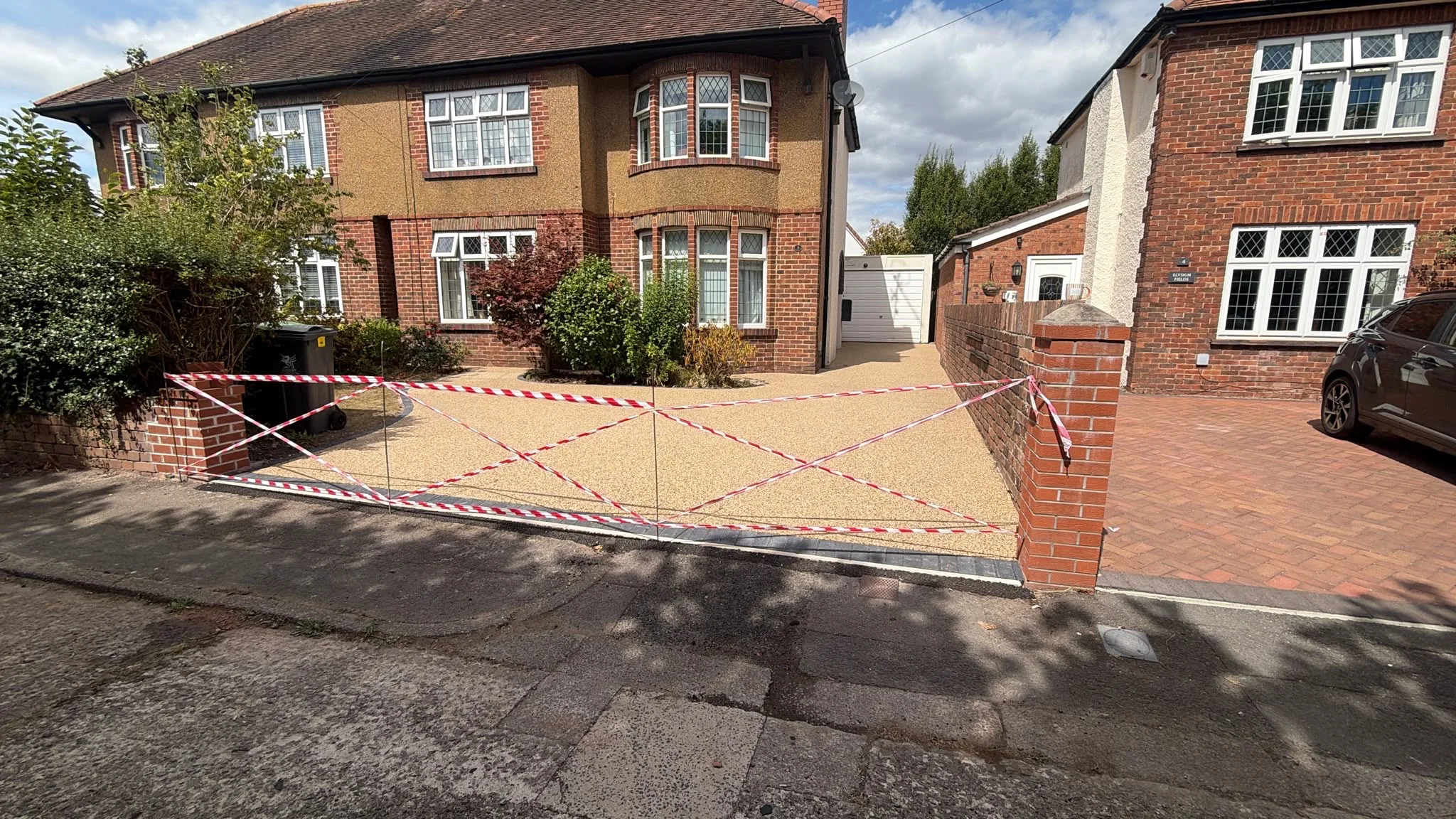 The completed driveway and front garden, framed by the new capped pillar and black block paving border, Rhiwbina, Cardiff 