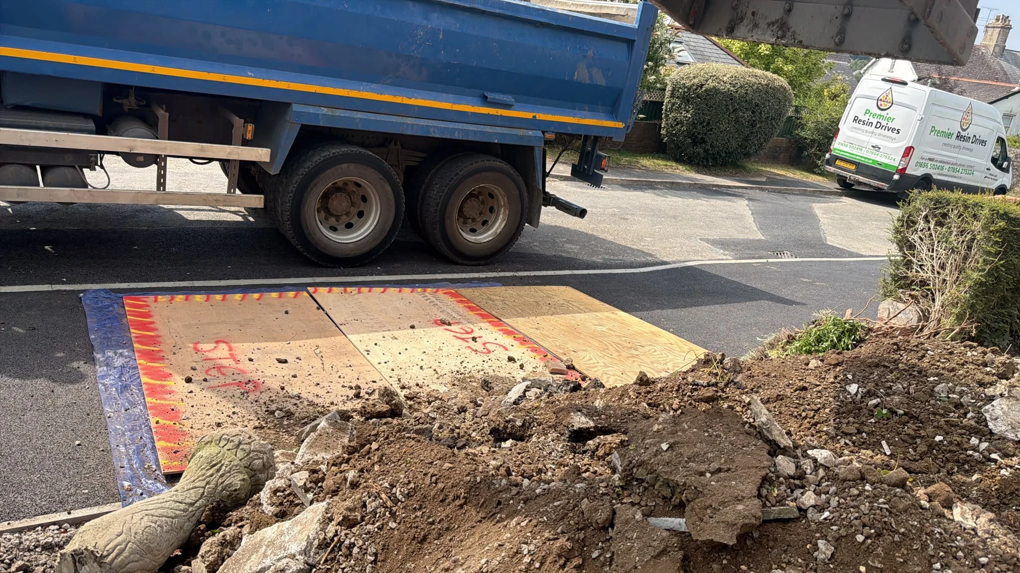 Digging out and removing the old debris, earth and concrete